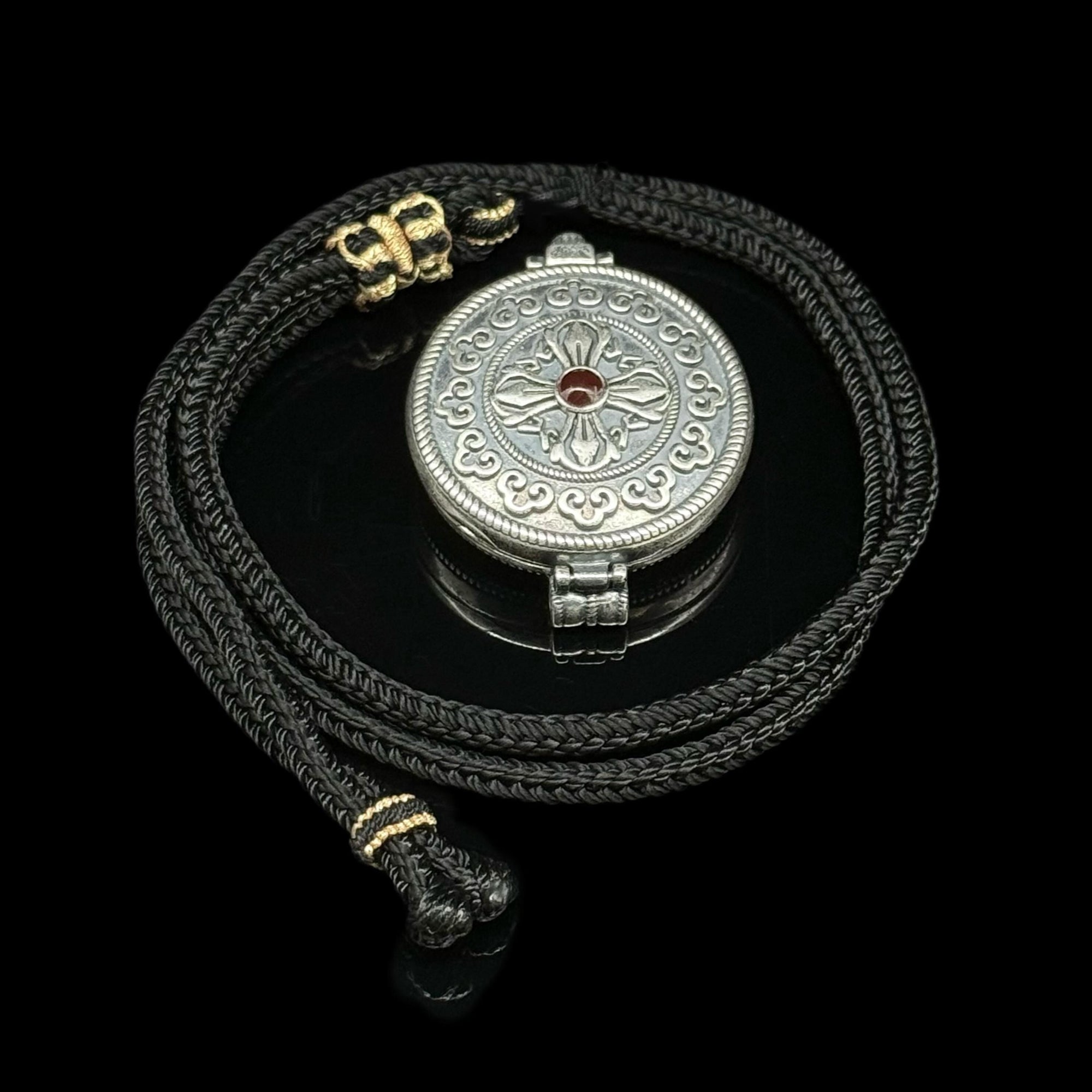 Original Design Eight Auspicious Symbols Kalu Box Pendant, paired with a hand-woven adjustable Perfect Peace necklace.