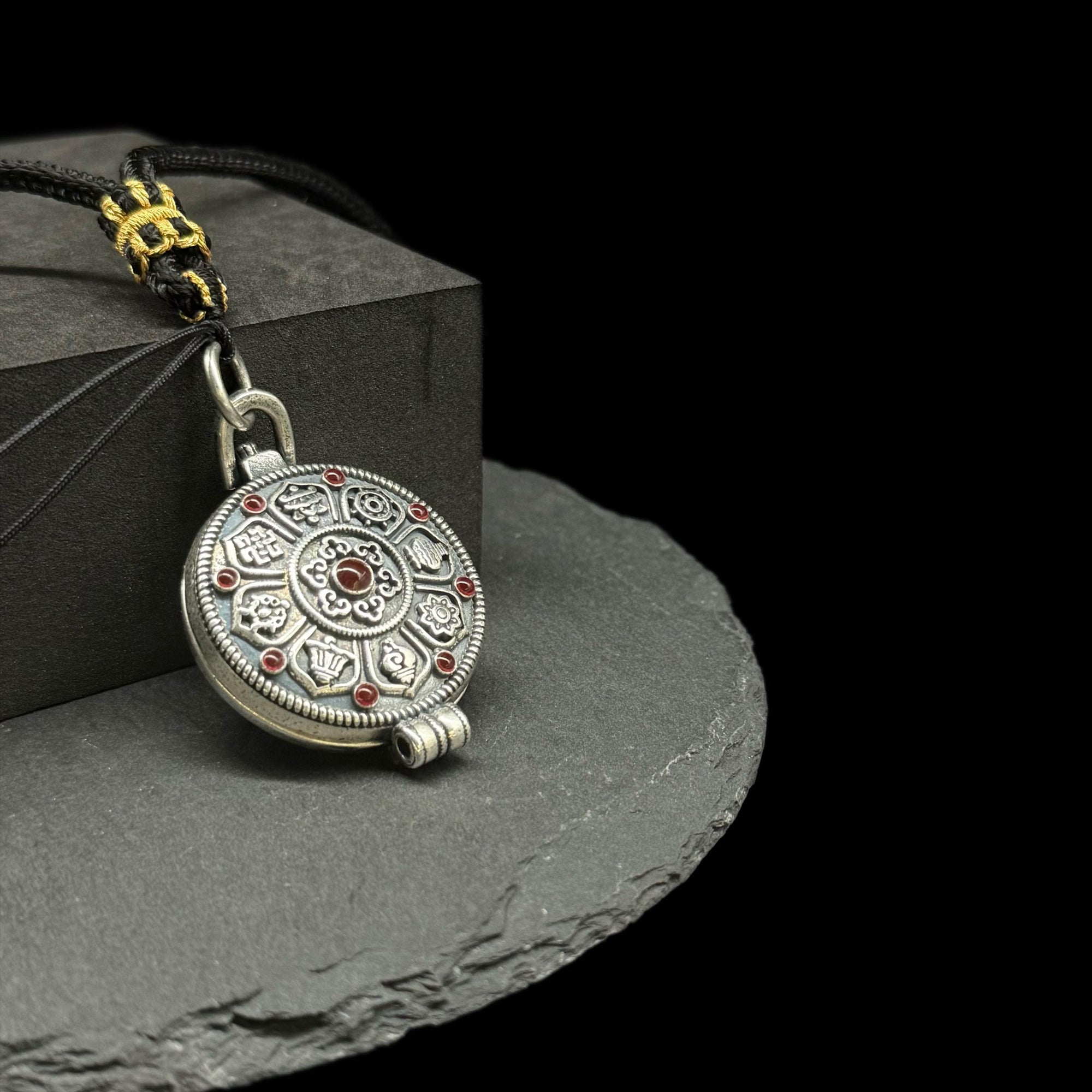 Original Design Eight Auspicious Symbols Kalu Box Pendant, paired with a hand-woven adjustable Perfect Peace necklace.